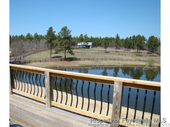 4435 Hoffman Road Jackson Springs, NC 27281 - Photo 22 of 25 a view of a lake from a balcony
