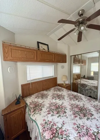 a bedroom with a bed and window