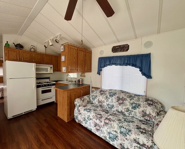 25-46 Woodhaven Sublette, IL 61367 - Photo 5 of 17 a kitchen with stainless steel appliances kitchen island granite countertop a stove and a refrigerator