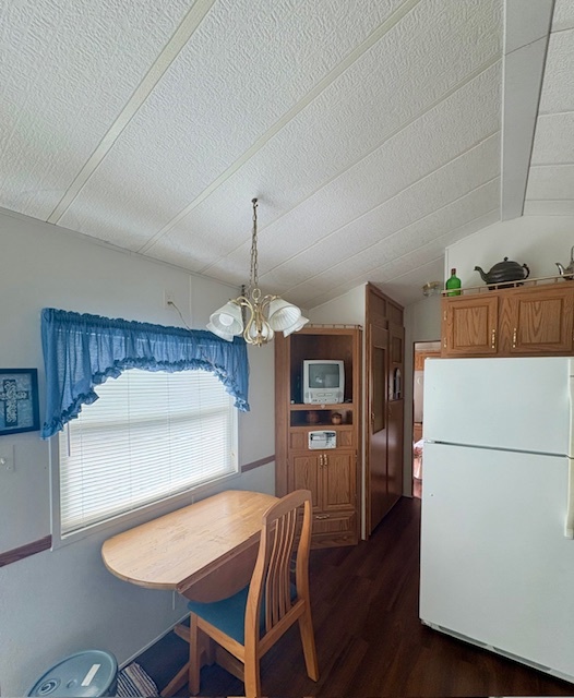 25-46 Woodhaven Sublette, IL 61367 - Photo 9 of 17 a kitchen with a table chairs refrigerator and microwave