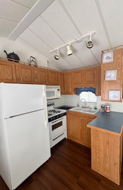 25-46 Woodhaven Sublette, IL 61367 - Photo 10 of 17 a kitchen with stainless steel appliances a refrigerator a stove a sink and white cabinets