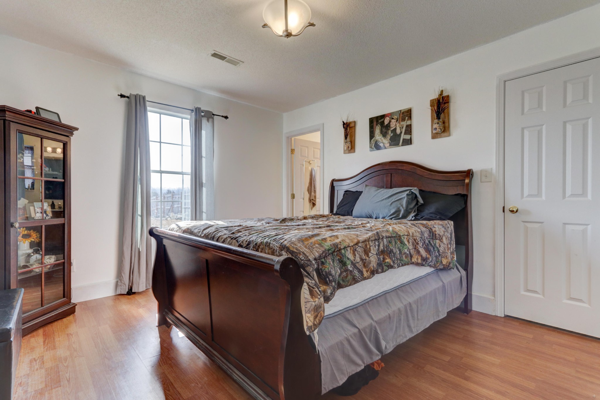 7832 Ralph Youmans Road Corryton, TN 37721 - Photo 13 of 22 a bedroom with a bed and a window