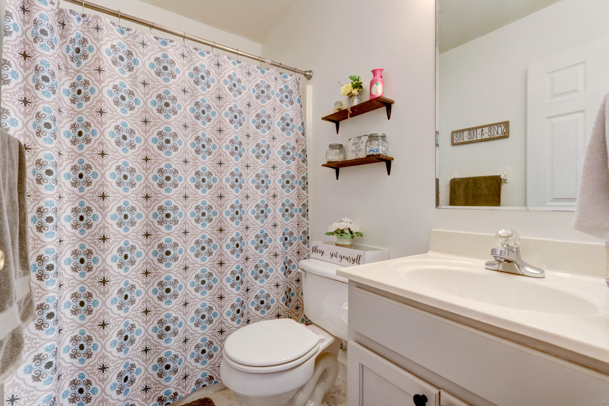 7832 Ralph Youmans Road Corryton, TN 37721 - Photo 18 of 22 a bathroom with a sink toilet and a mirror