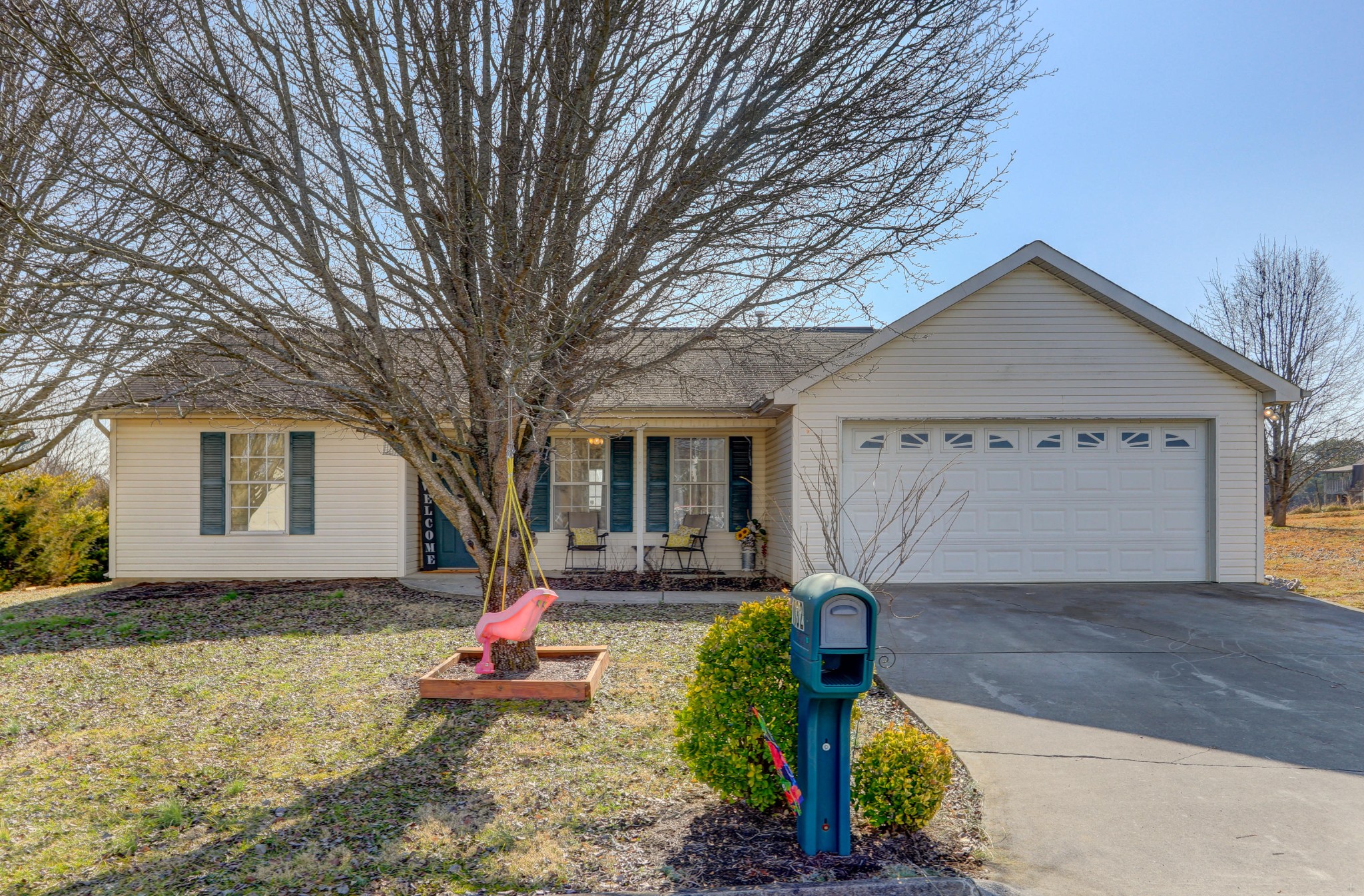 7832 Ralph Youmans Road Corryton, TN 37721 - Photo 19 of 22 a front view of a house with a yard and garage