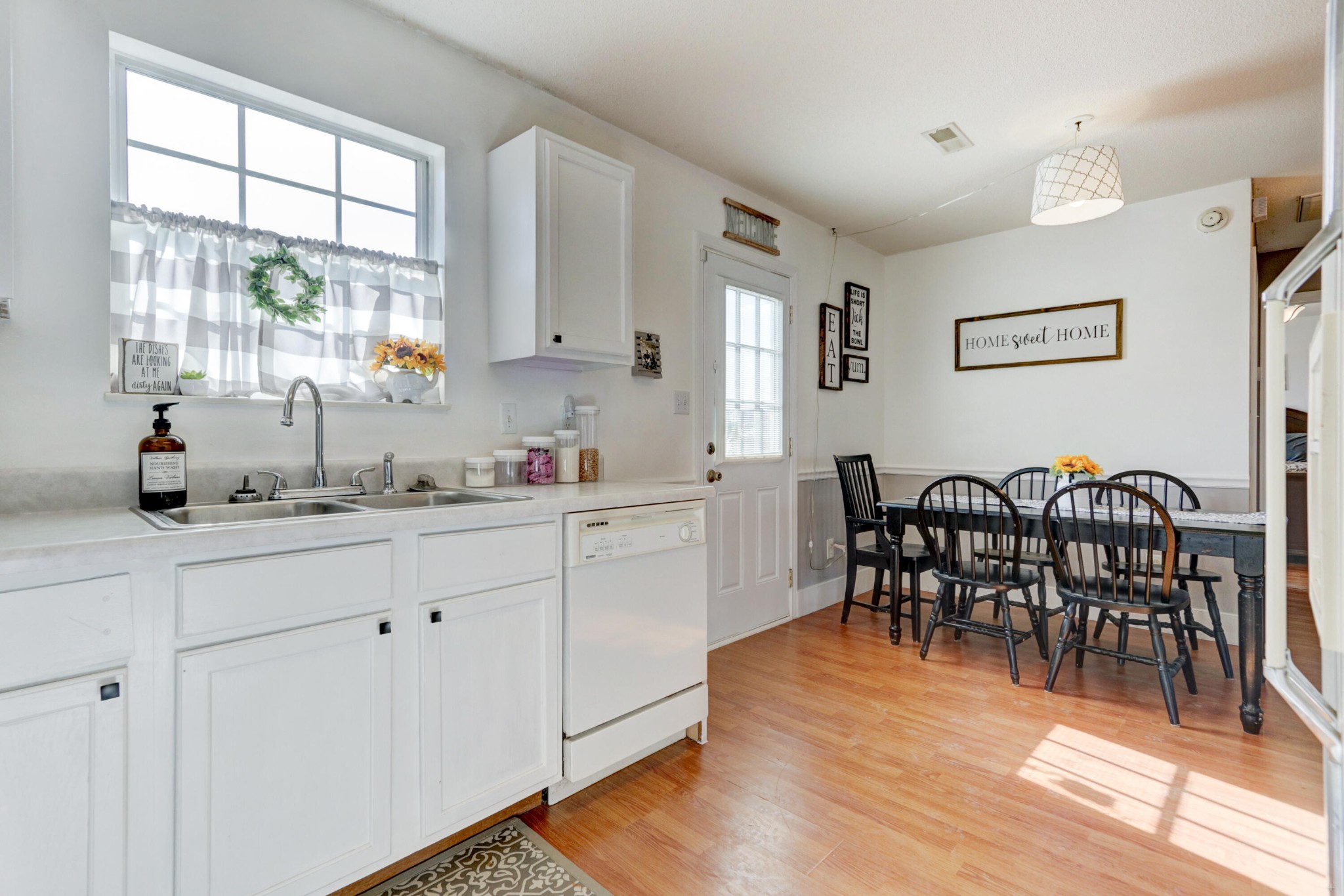 7832 Ralph Youmans Road Corryton, TN 37721 - Photo 22 of 22 a kitchen with stainless steel appliances granite countertop a dining table chairs and a window