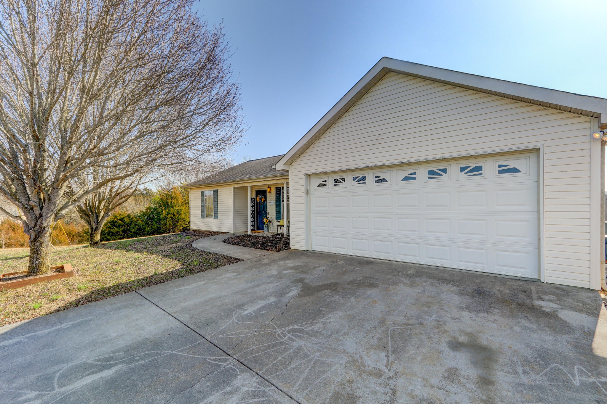 7832 Ralph Youmans Road Corryton, TN 37721 - Photo 4 of 22 a view of a house with a yard and garage