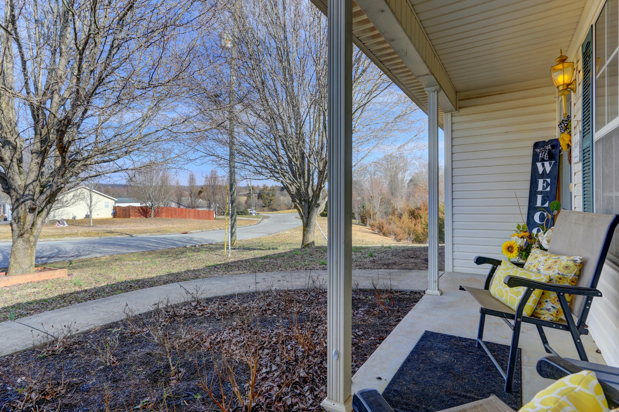 7832 Ralph Youmans Road Corryton, TN 37721 - Photo 8 of 22 a view of a porch with furniture and a yard