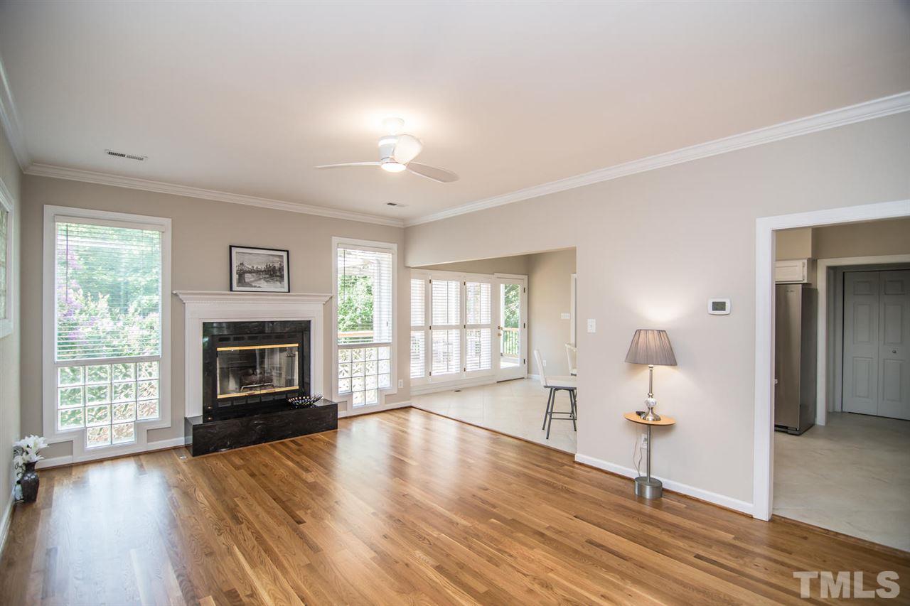 2001 Longwood Drive Raleigh, NC 27612 - Photo 2 of 25 a living room with furniture and a fireplace