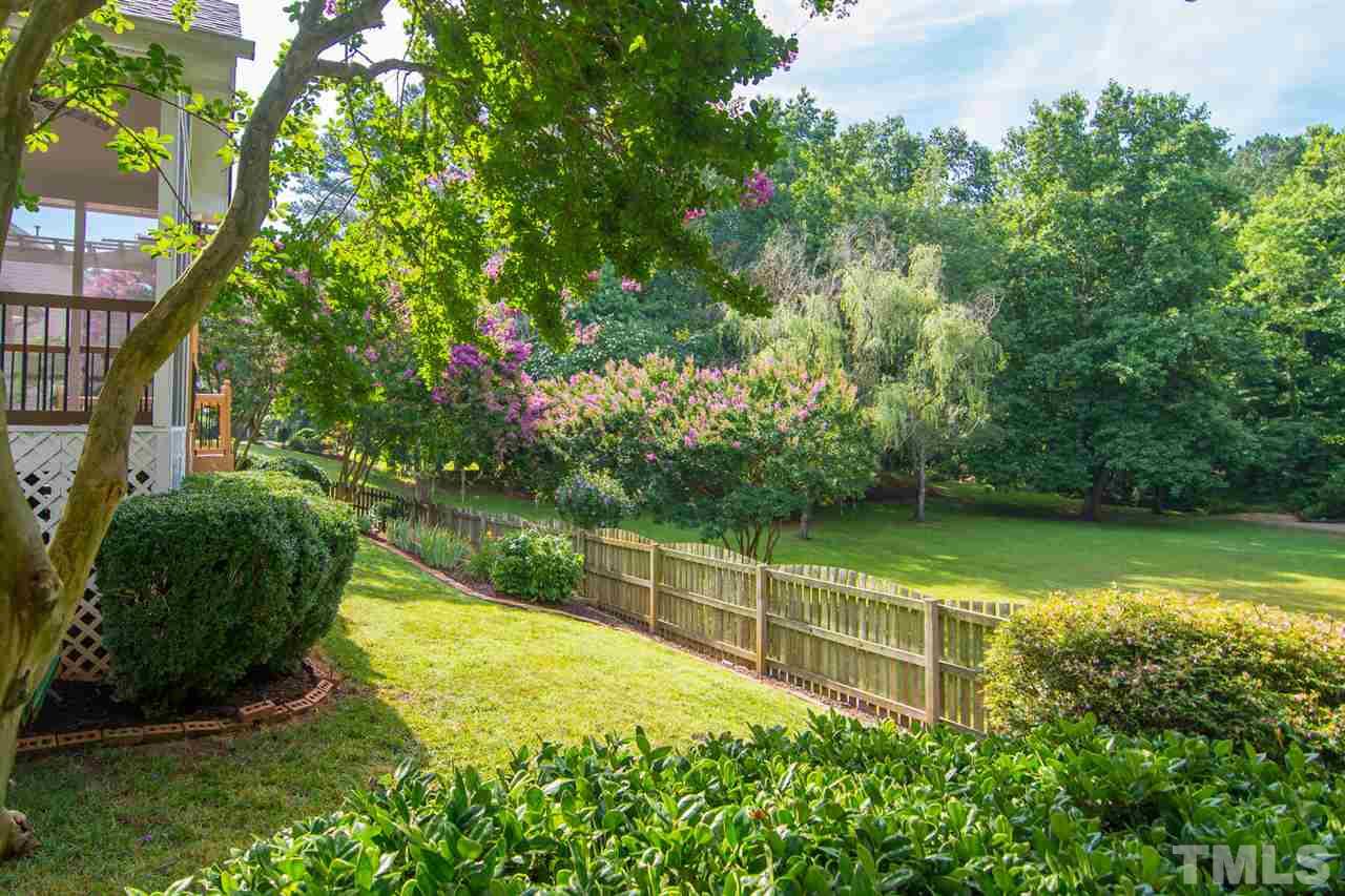 2001 Longwood Drive Raleigh, NC 27612 - Photo 16 of 25 a view of a garden with a bench