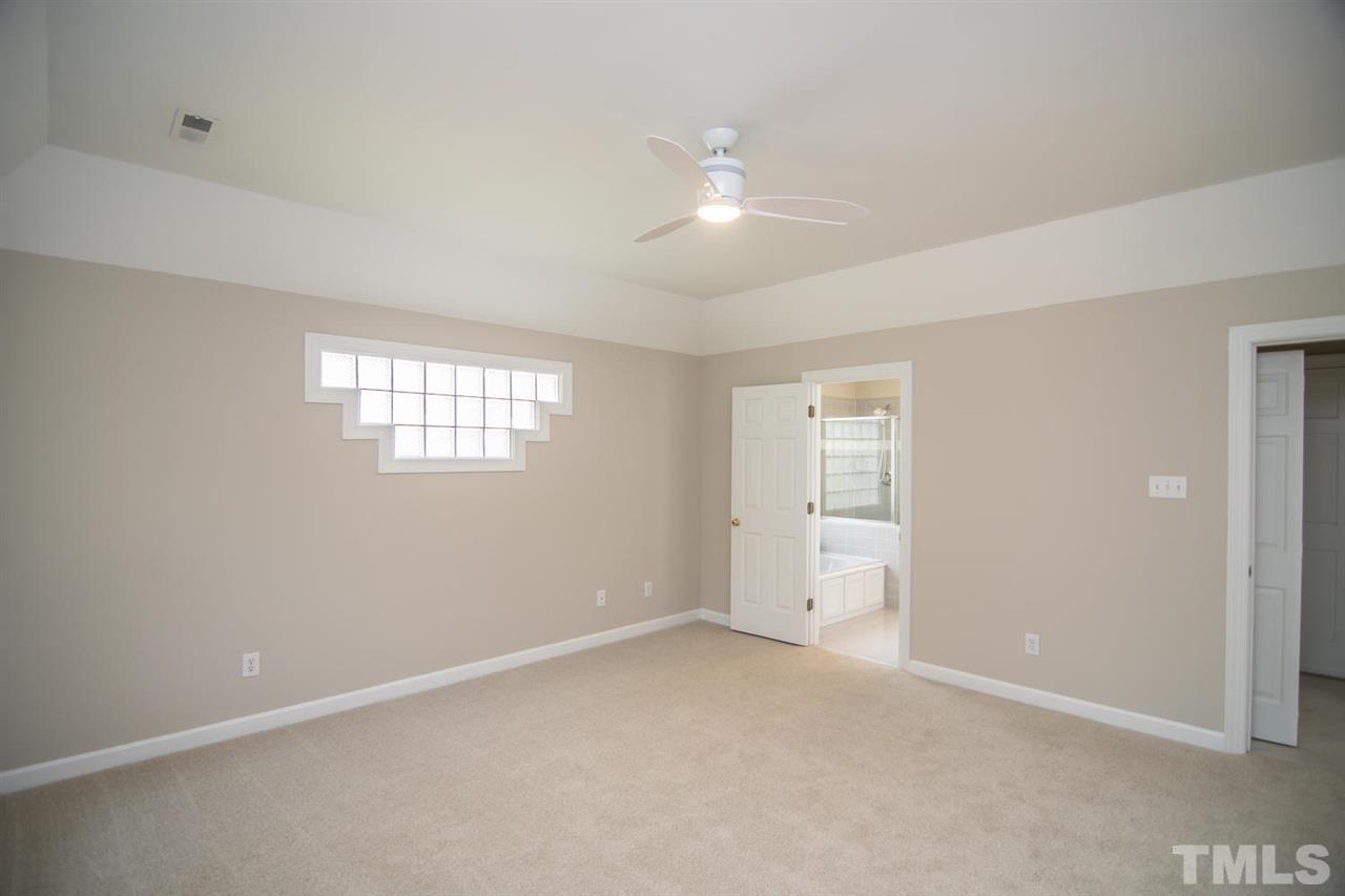 2001 Longwood Drive Raleigh, NC 27612 - Photo 17 of 25 a view of an empty room with a window