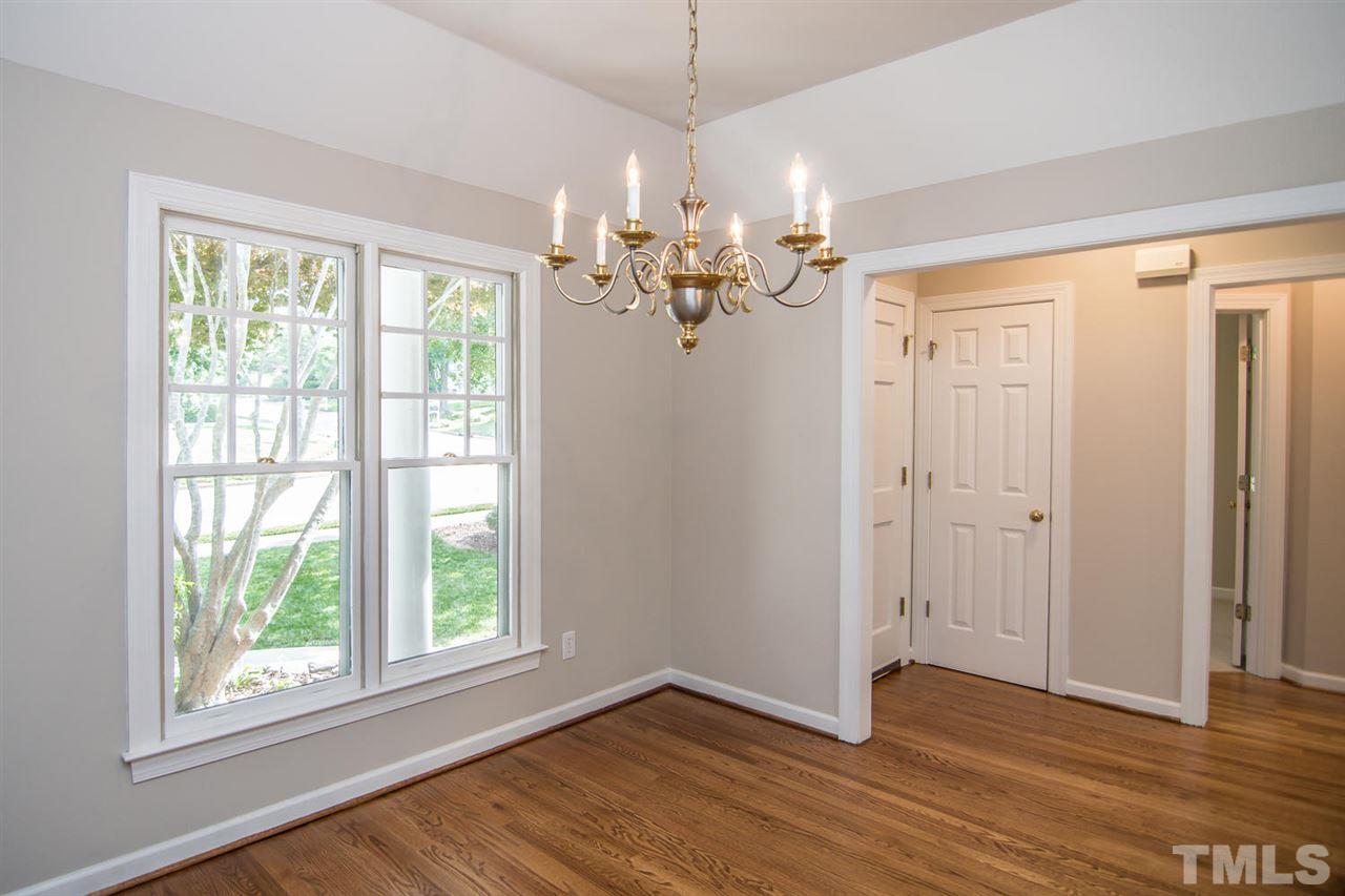 2001 Longwood Drive Raleigh, NC 27612 - Photo 4 of 25 a view of a livingroom with a window and wooden floor