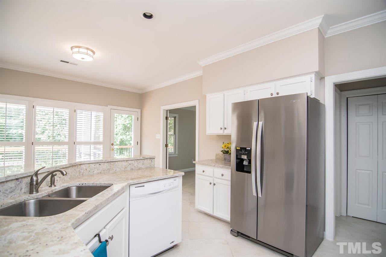 2001 Longwood Drive Raleigh, NC 27612 - Photo 7 of 25 a kitchen with stainless steel appliances granite countertop a refrigerator and a sink