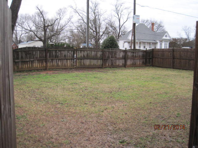 419 Bob White Road Macon, GA 31216 - Photo 3 of 13 a view of a yard with wooden fence
