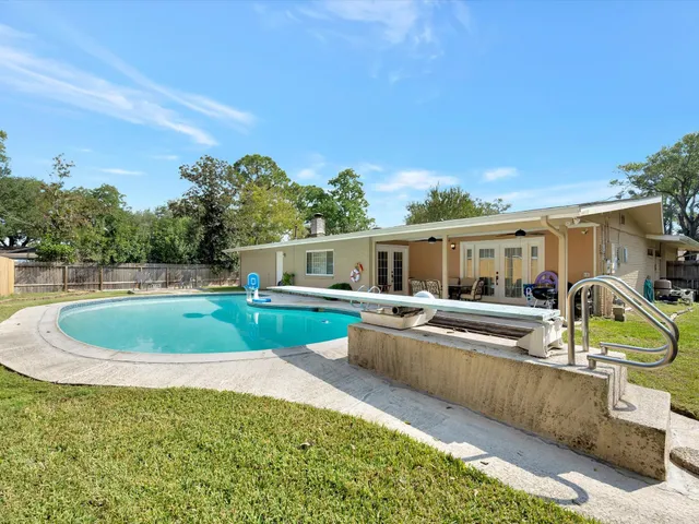 a view of a house with swimming pool