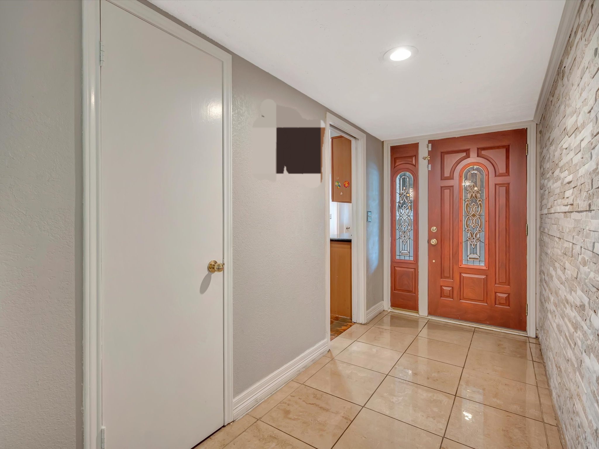 1615 Redway Lane Houston, TX 77062 - Photo 6 of 32 Entry with stacked stone accent wall and tile floors
