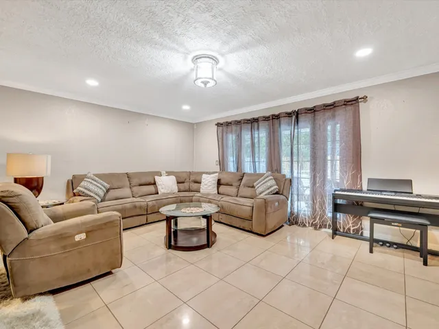 a living room with furniture and a table