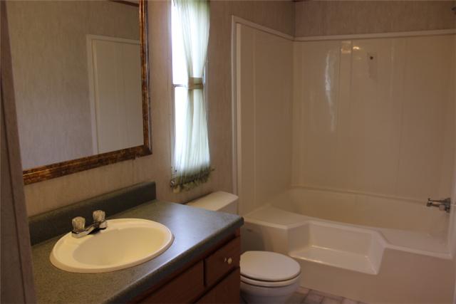 5173 Esbon Holland Road Springfield, TN 37172 - Photo 7 of 17 a bathroom with a sink toilet and shower
