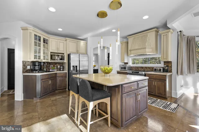 a spacious bathroom with a toilet sink and mirror