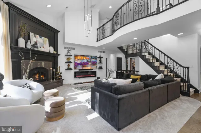 a living room with furniture ceiling fan and a rug