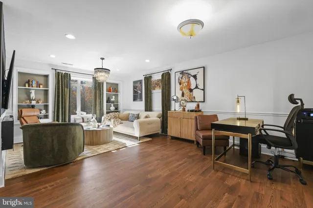 a living room with furniture and a night stand