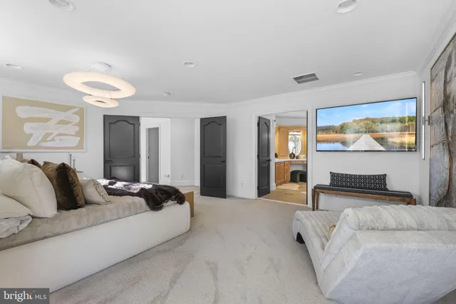 a large bathroom with a large tub sink and mirror