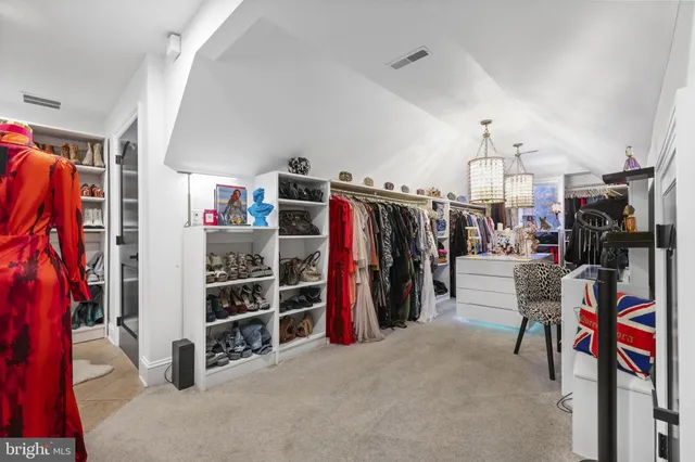 a view of living room with furniture and fireplace