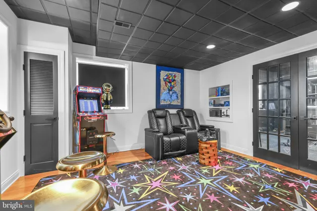 a view of a room with wooden floor and windows