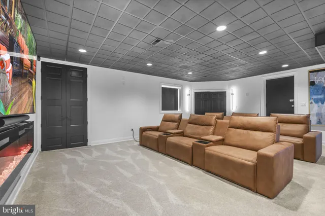 a view of a patio with couches and a fire pit