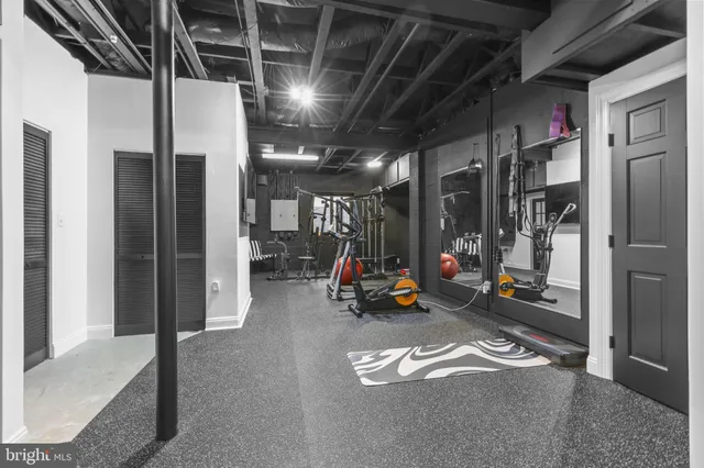 a white house with a big yard and large trees