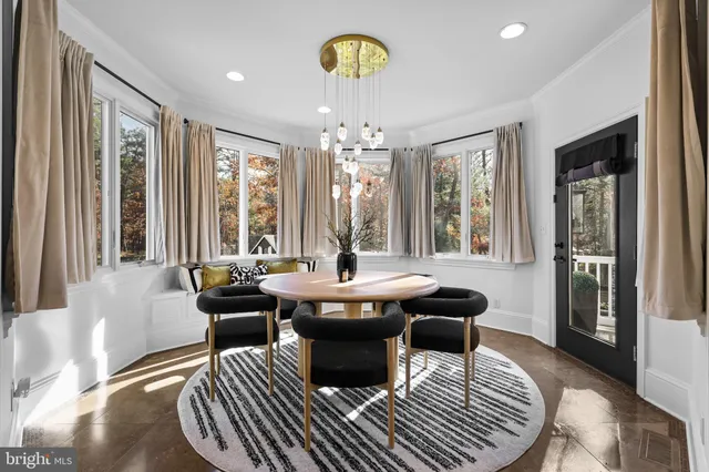 a kitchen with a sink stainless steel appliances and white cabinets