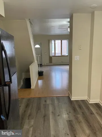 a view of a living room with a fireplace