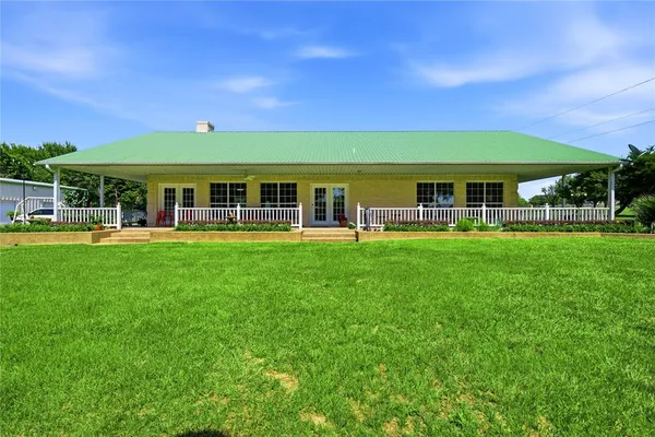 a view of a building with a yard