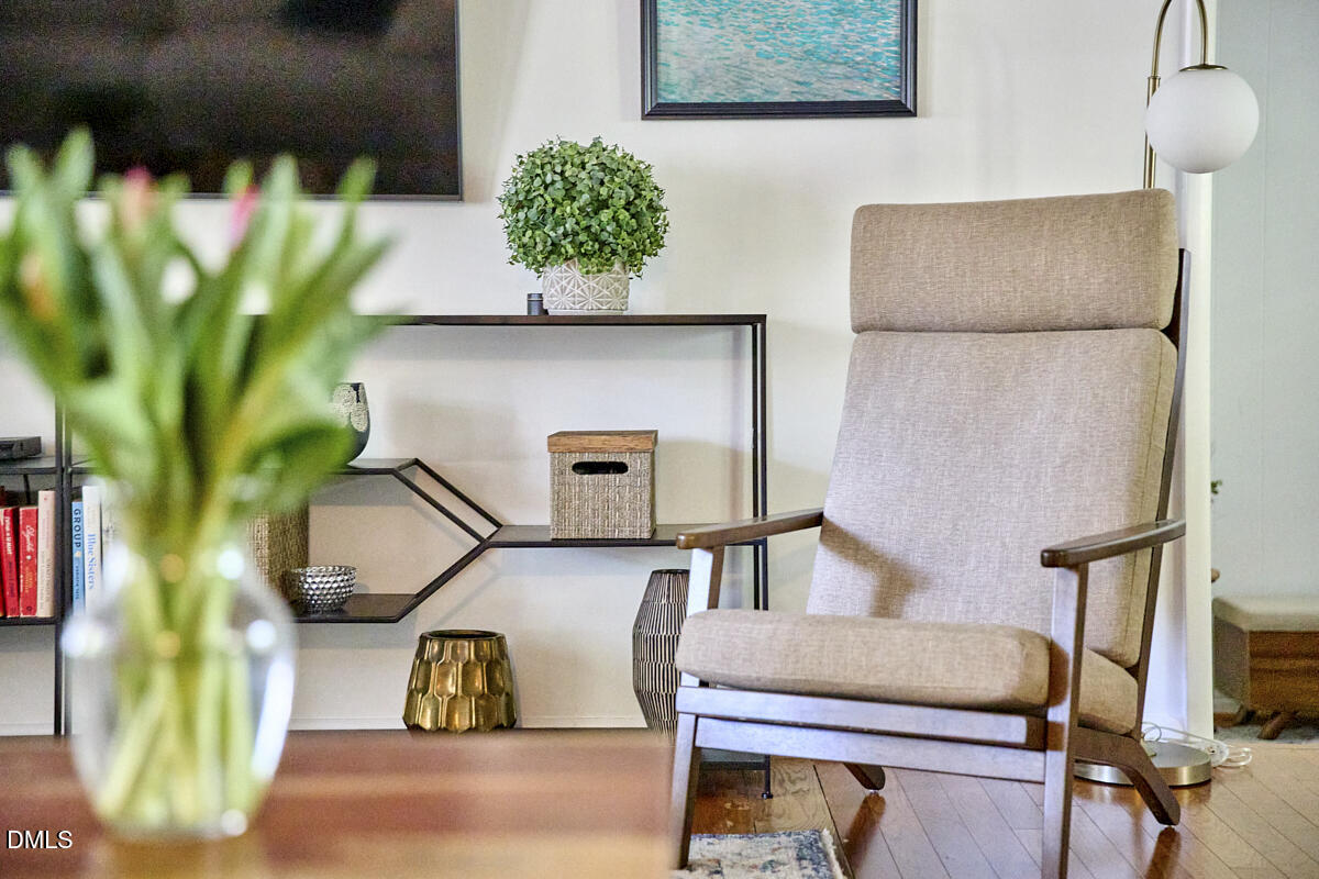 4916 Latimer Road Raleigh, NC 27609 - Photo 11 of 30 a living room with furniture and a potted plant