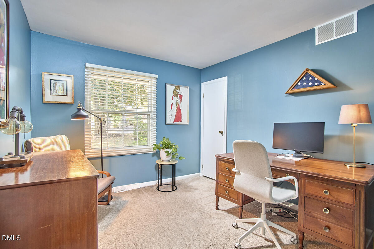 4916 Latimer Road Raleigh, NC 27609 - Photo 19 of 30 a workspace with furniture and a window