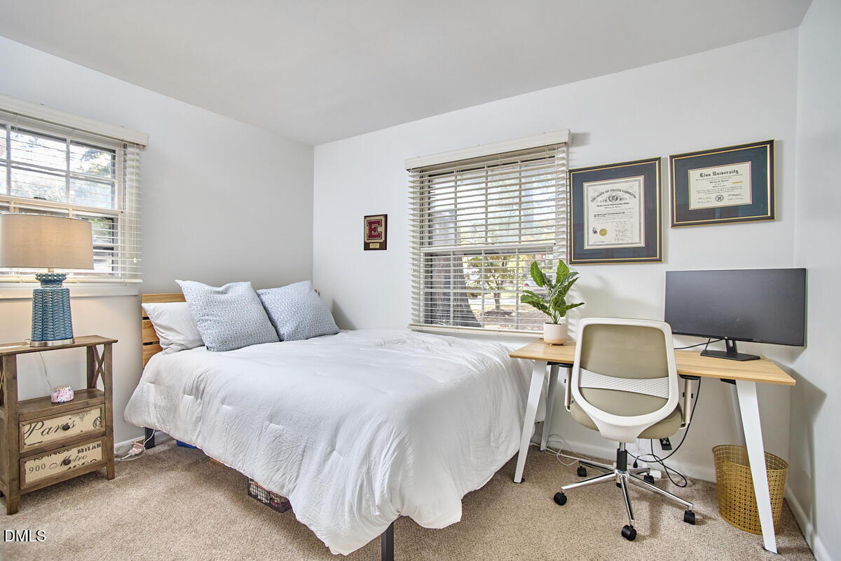 4916 Latimer Road Raleigh, NC 27609 - Photo 21 of 30 a bedroom with furniture and a window