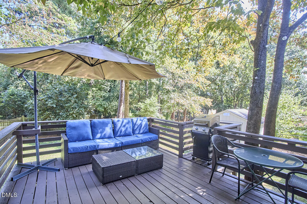 4916 Latimer Road Raleigh, NC 27609 - Photo 25 of 30 a view of sitting area in balcony with wooden floor and outdoor seating