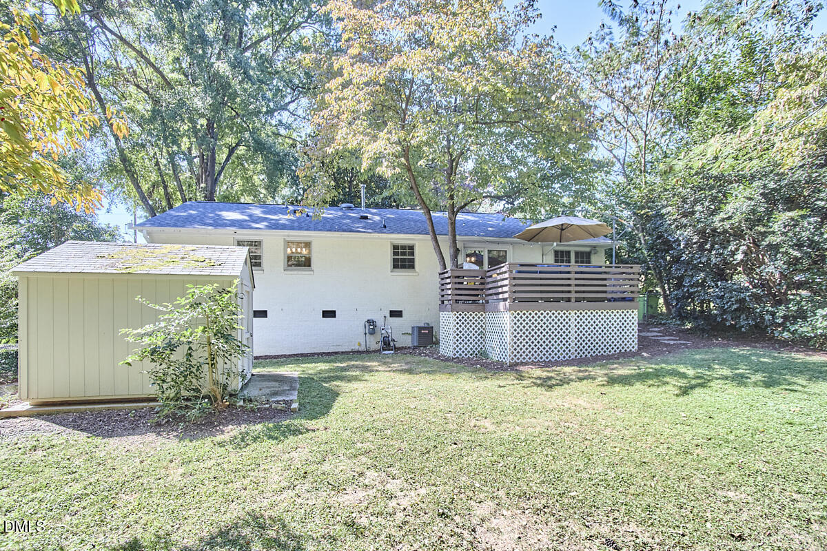 4916 Latimer Road Raleigh, NC 27609 - Photo 30 of 30 a front view of a house with a yard and garage