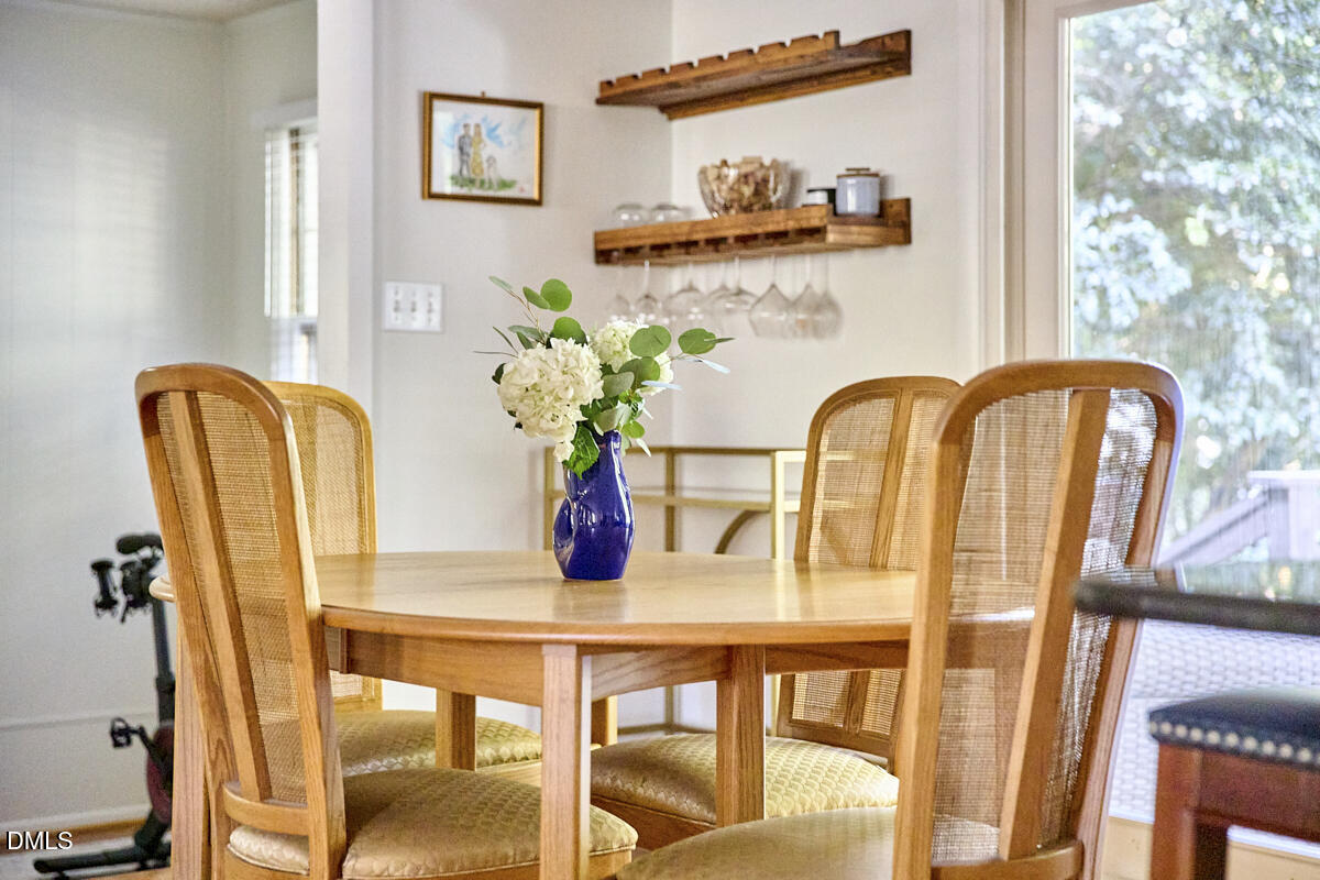 4916 Latimer Road Raleigh, NC 27609 - Photo 5 of 30 a dining room with furniture and potted plant