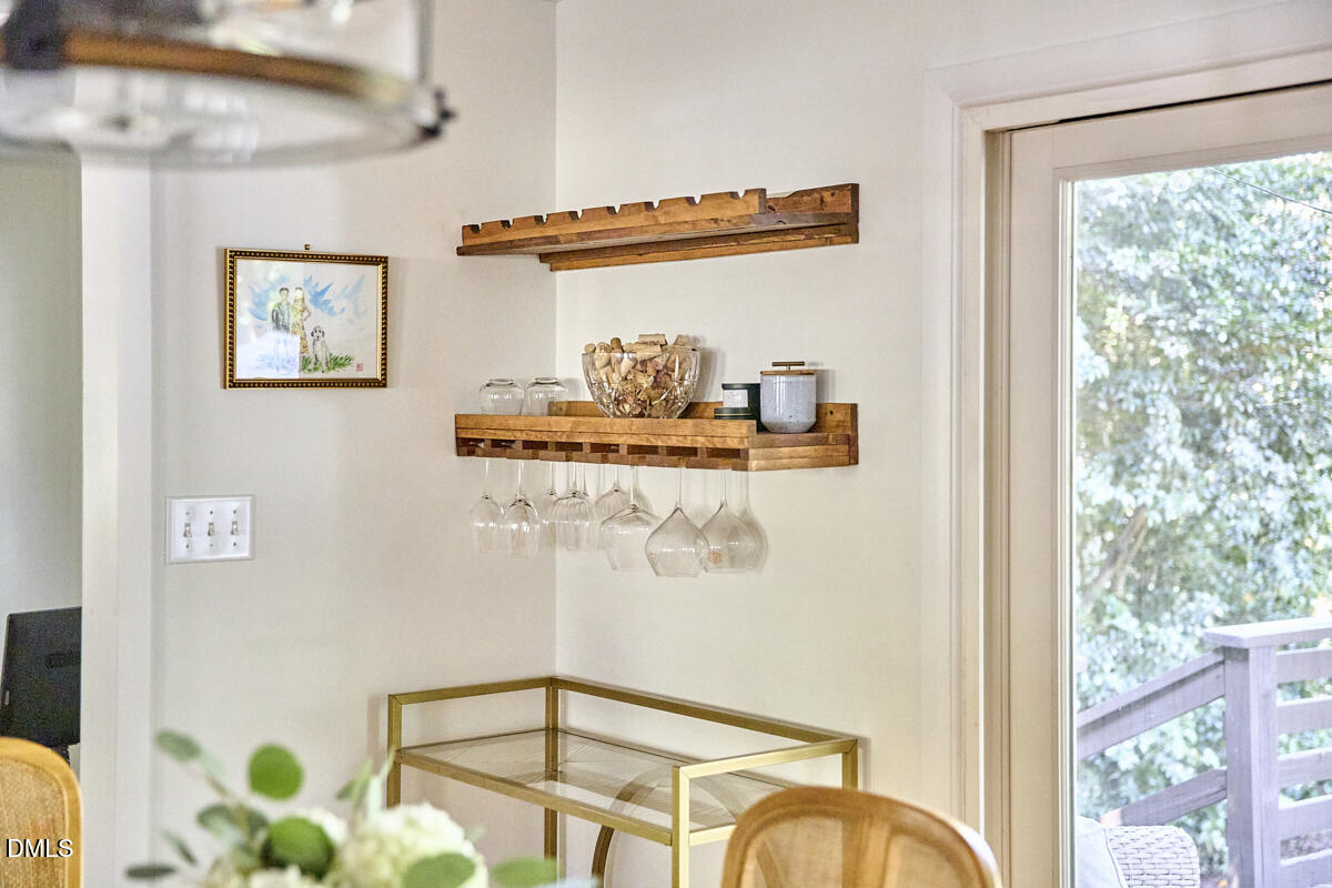 4916 Latimer Road Raleigh, NC 27609 - Photo 6 of 30 a picture of a glass table with painted walls