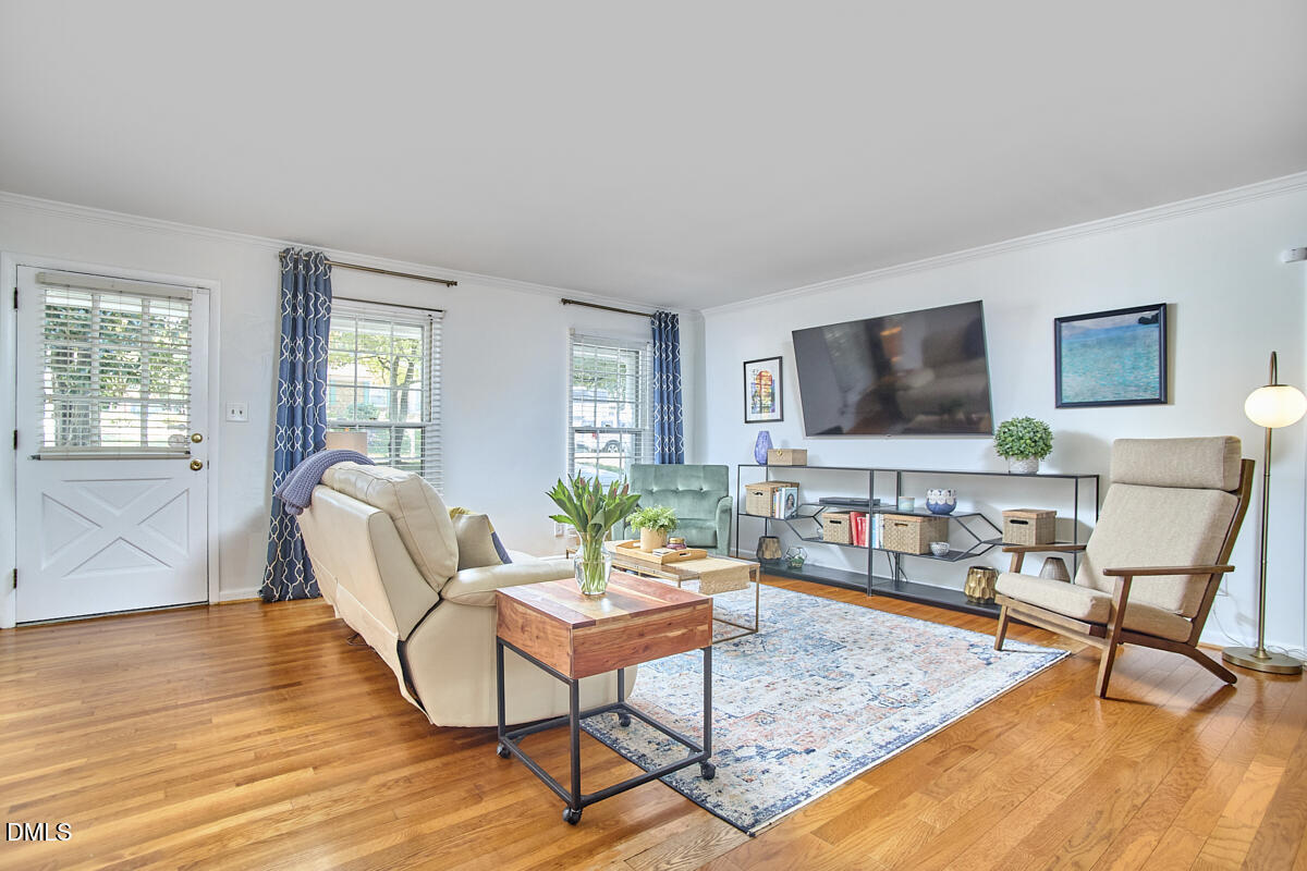 4916 Latimer Road Raleigh, NC 27609 - Photo 7 of 30 a living room with furniture and a flat screen tv
