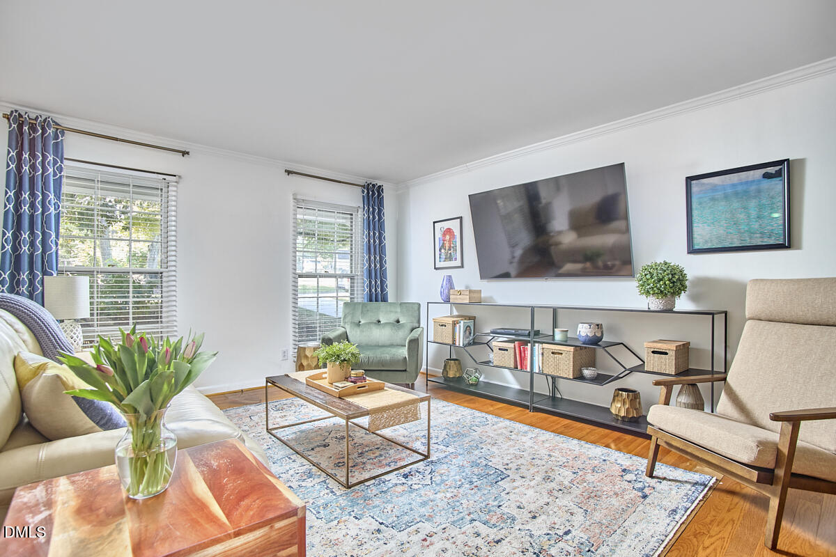 4916 Latimer Road Raleigh, NC 27609 - Photo 9 of 30 a living room with furniture and a flat screen tv