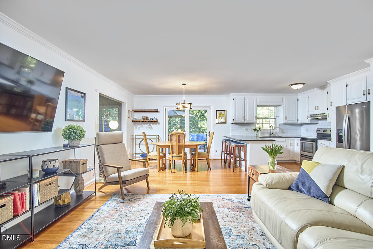 4916 Latimer Road Raleigh, NC 27609 - Photo 10 of 30 a living room with furniture fireplace and a table
