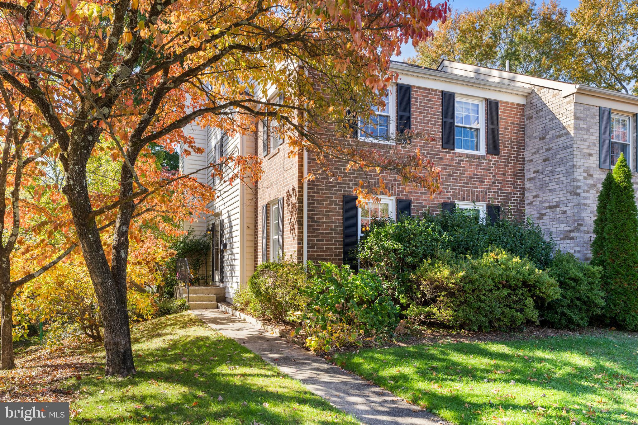 2110 Sandy Court Crofton, MD 21114 - Photo 1 of 50 a view of a brick house with a large windows and a big yard