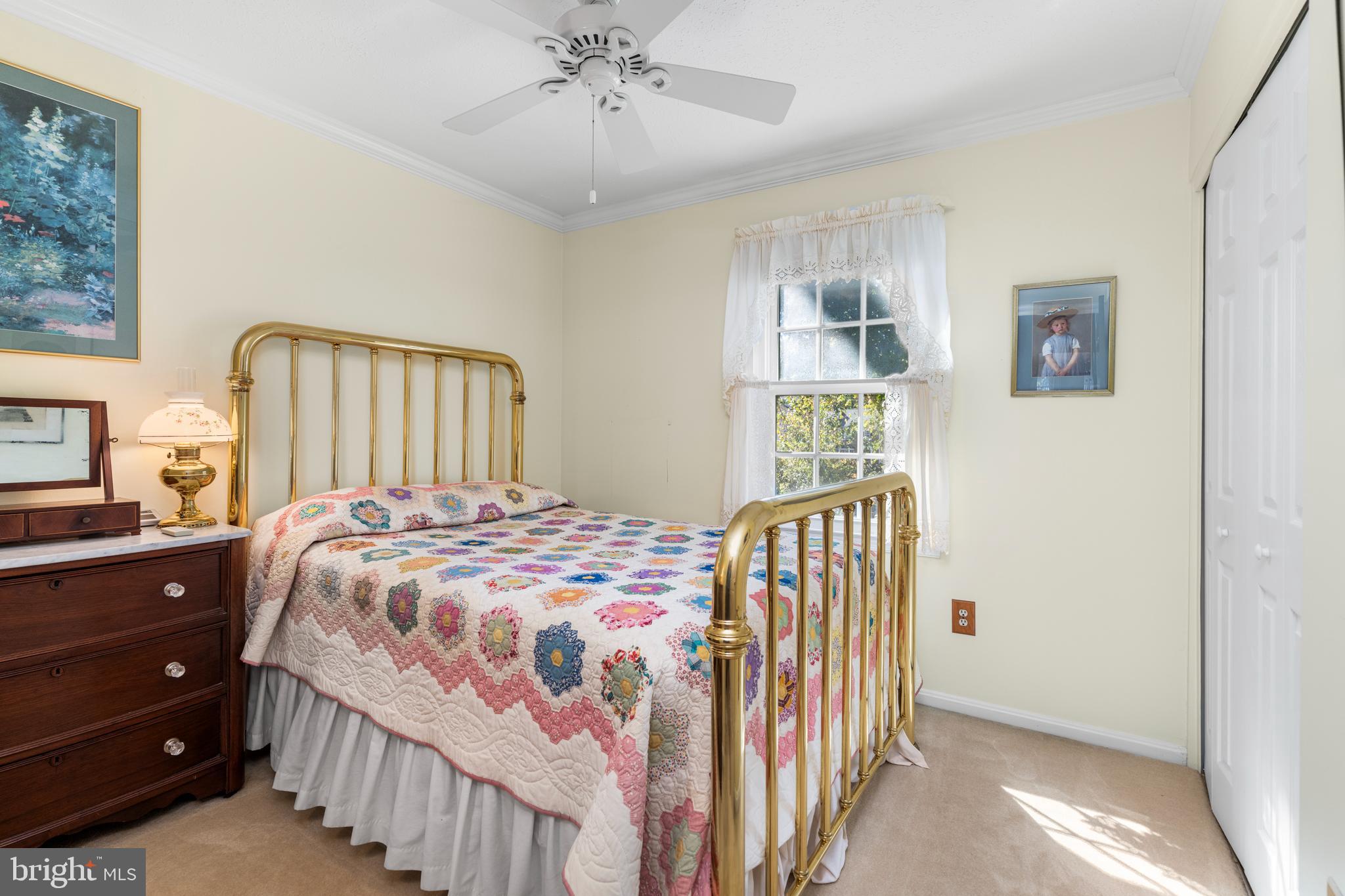 2110 Sandy Court Crofton, MD 21114 - Photo 22 of 50 a bedroom with a bed and a chandelier