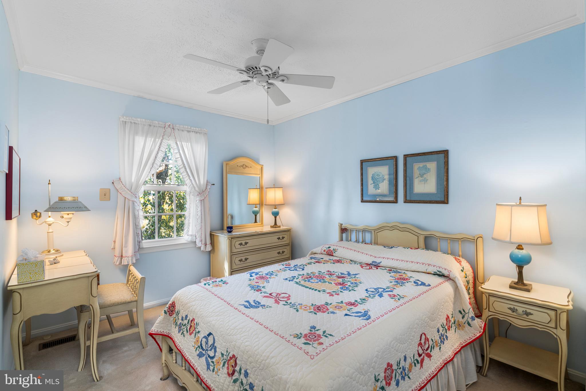 2110 Sandy Court Crofton, MD 21114 - Photo 26 of 50 a bedroom with a bed a chandelier and dresser