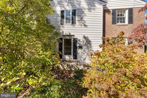 a view of a house with a tree