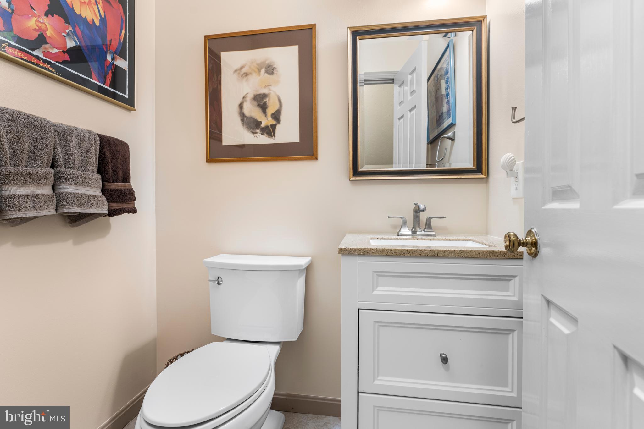 2110 Sandy Court Crofton, MD 21114 - Photo 31 of 50 a bathroom with a toilet sink vanity and mirror