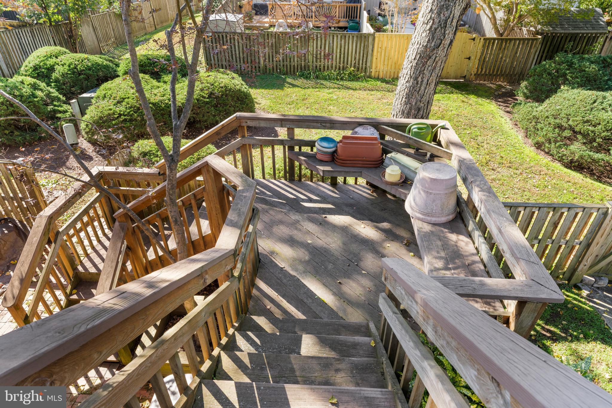 2110 Sandy Court Crofton, MD 21114 - Photo 34 of 50 a view of an outdoor sitting area with wooden fence