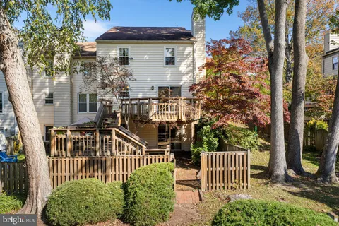 a view of a house with a fence
