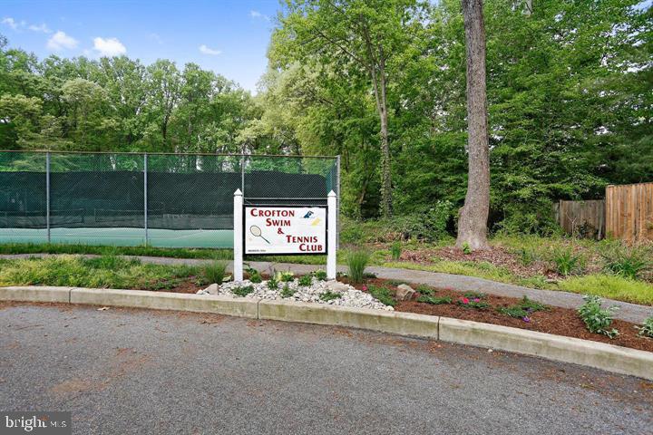 2110 Sandy Court Crofton, MD 21114 - Photo 40 of 50 a sign board with a play ground in the back